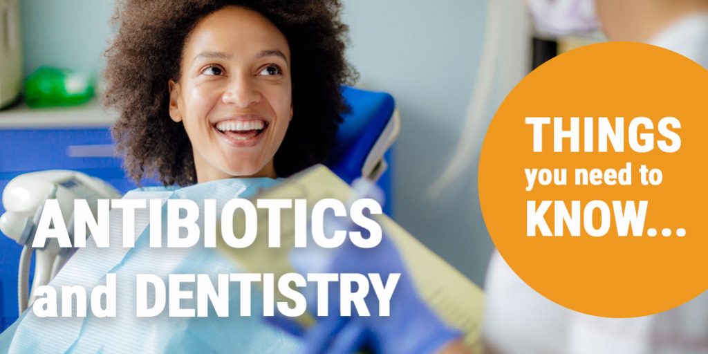 Image of woman sitting in dentist chair, smiling at dentist. Overlaid text reads "Antibiotics and dentistry. Things you need to know."